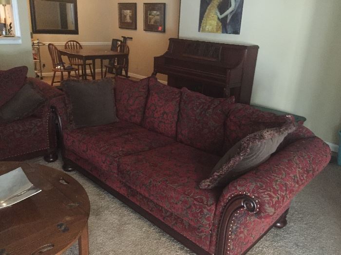 Large red sofa with matching loveseat