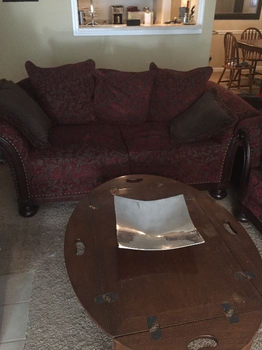 Red loveseat with coffee table