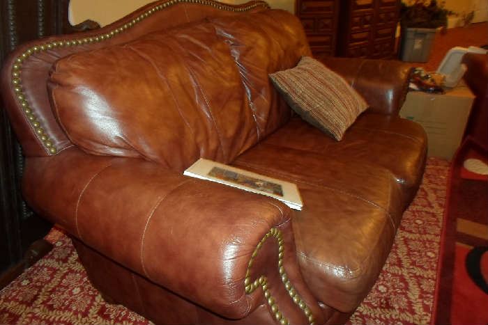 pair of these leather loveseats