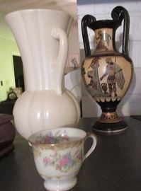 Greece 2-handled vase in background.  White is USA.