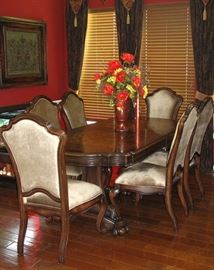 New Castle Double Pedestal Dining Table (86" X 42")   Stained in a dark Mahogany With a Faux Lizard Stamped Apron.  Top is Stenciled, Etched Fleur de Lis  Pattern.  6 Cabriole Legs, High Back Upholstered Chair Side Chairs.