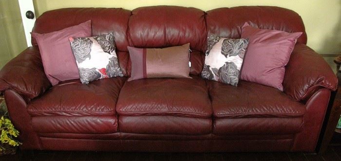 Palliser Burgundy Leather Sofa with Various Throw Pillows 