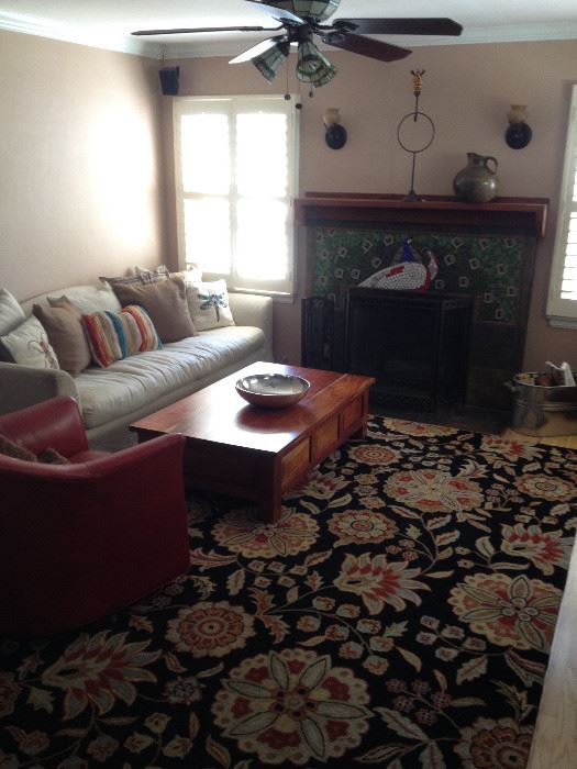 rug, leather couch. leather chairs, craftsman coffee table