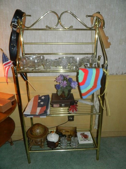 Goldtone metal Baker's Rack, Gun holster, glassware, various collectibles