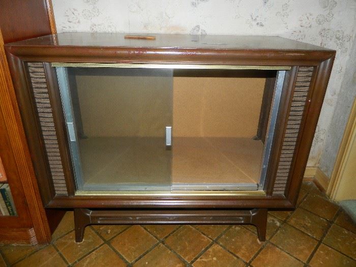 One of several old tv cabinets - emptied of all electronics