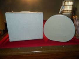 Briefcase, vintage hair dryer, books