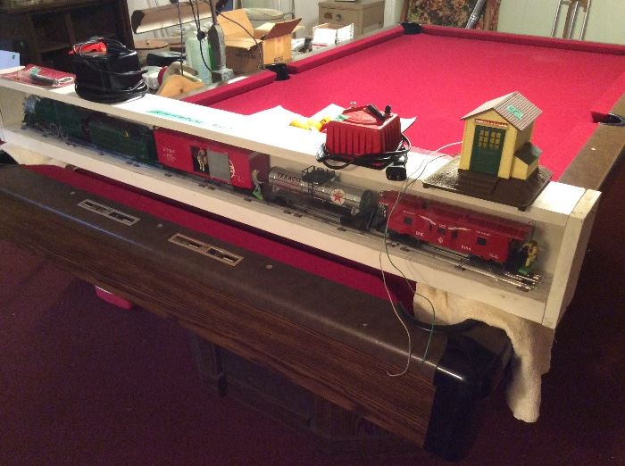 Train set on end of pool table. Vintage pool table in excellent condition.