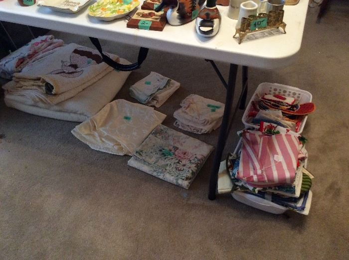 Collectibles, quilts, linens, aprons, kitchen towel sets, pot holders. Some are vintage.