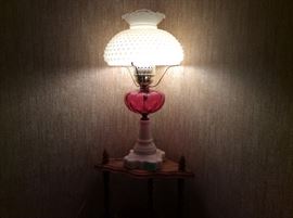 This is the Vintage White Hobnail & Cranberry Lamp turned on.  Beautiful lamp & works great! 