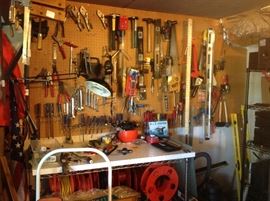This is Just some of the tools Plus Large piles oF Yard and garden tools