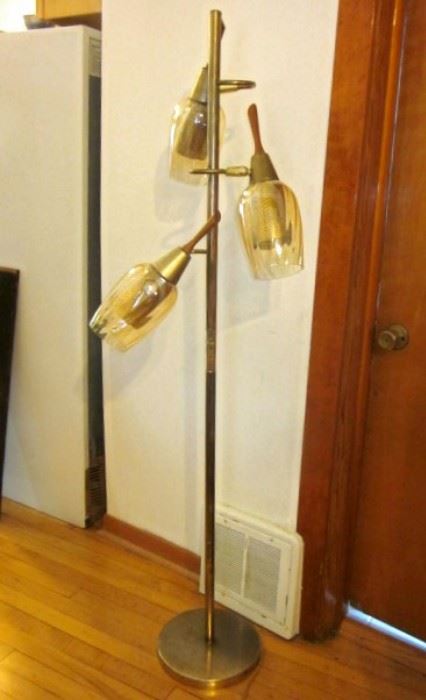 Mid Century pole floor lamp with 3 lights.  Amber glass with pierced brass under-shades and teak wood finials.  Works ... no damage to glass!