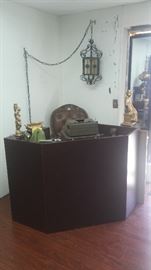 Store reception desk matches store display cases