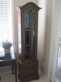 Slender curio cupboard.