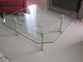 Glass topped coffee table.