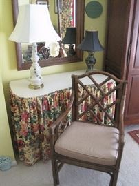 Dressing table, lamps, mirror and armchair.