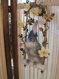 Porcelain Parrot on a perch.