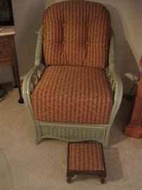 Wicker armchair and footstool.