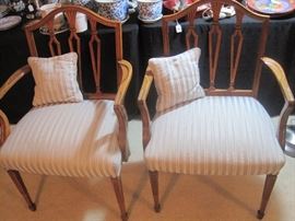 A pair of nicely upholstered chairs.