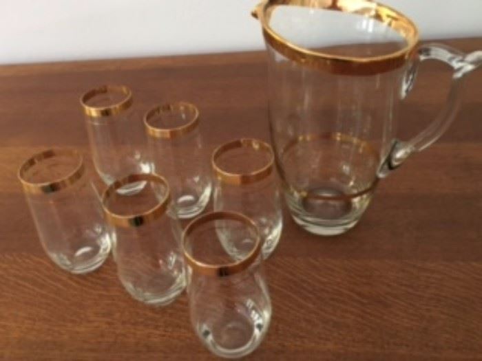 Gold rimmed crystal pitcher and 6 matching glasses