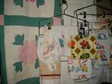 many vintage quilts and linens