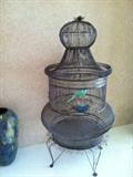 this metal bird cage is approximately 6 feet tall