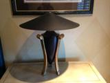 there is a pair of matching metal lamps