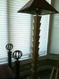 there is a pair of matching floor lamps