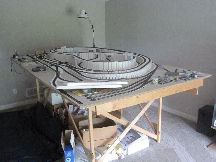 Ho scale train layout with trains and accessories.