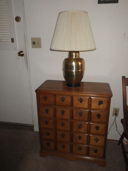 20 drawer chest and brass milk jug lamp