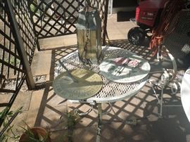 metal table, cement stones, lantern