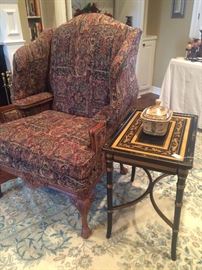 Upholstered wing back chair; hand painted side table