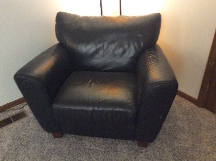 One of 3 matching full leather overstuffed chairs by