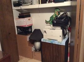 Closets full of office items including reams of copy paper