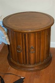A solid wood end table.  The handles are used to open the doors revealing a large storage area to keep hidden treasures.
