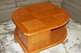 A coffee table with plenty of display space on top and in the open spaces below.  There is also plenty of hidden storage behind the doors.