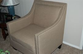 An almost new nail head occasional chair, neutral in color, a great addition to any room.