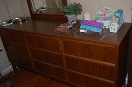 A nine drawer wood dresser.  The top is actually formica, making for an easy clean and very resistant to staining and scratching.