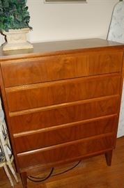 The chest of drawers that matches the dresser and headboard.