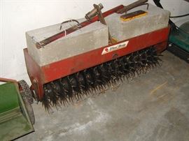Pull behind garden aerator