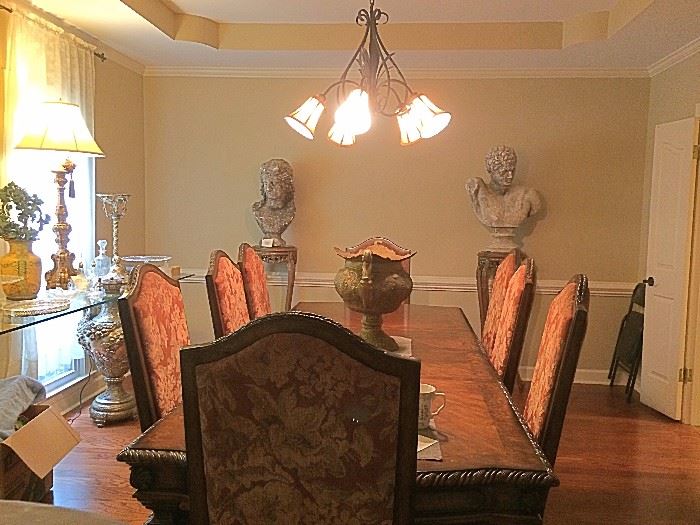 DINING ROOM TABLE WITH MATCHING CHINA CABIENT AND 8 DINING ROOM CHAIRS ,LARGE  sculpture bust  male is  about 32 inches tall and about 20 inches wide  --- female is  about 27 inches tall and 15 inches wide  made of concret ,  glass top table  (130 long by 24 wide about 34 inches tall ) with urns as the base , Tissington gold lamps, pedestal stands 