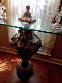 glass top table -  large urns used as the base made in Germany 