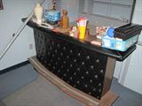 Cool tufted bar with stools. Still working in the basement level and porch areas. So much stuff too little time.