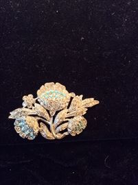 Unmarked floral brooch with clear sets and turquoise