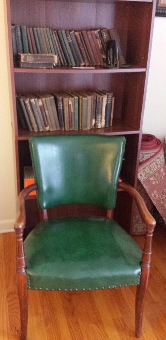 old books, vintage green upholstered chair
