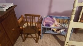 nice piece of furniture to the left that could be used as anything! bedroom living room storage galore children's play pieces rocker, baby bed
