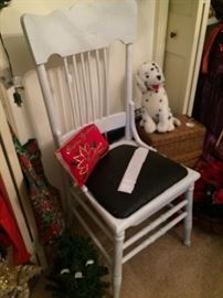 One of two antique chairs (One is white; one is red.)