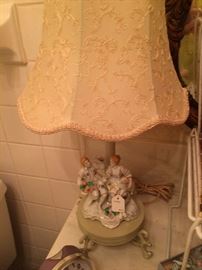 One of two matching figurine lamps