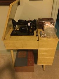 Vintage sewing machine in Mid-Century Modern cabinet