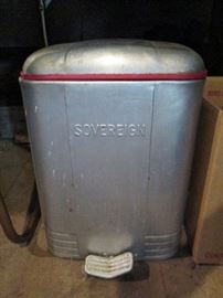 Sovereign metal foot pedal trash can. Inside there is a receptacle with a handle. Lift the receptacle out for easy trash removal. 