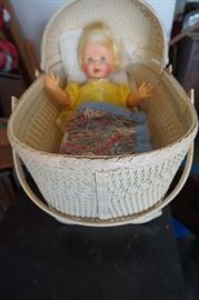 doll in baby carrier basket